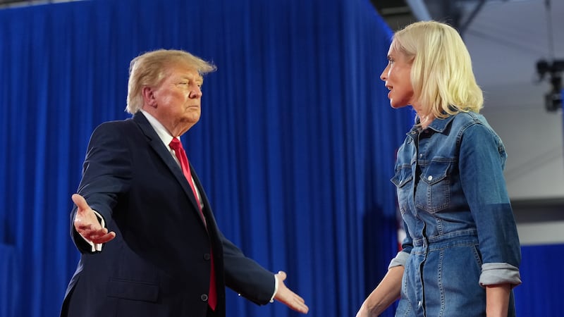 President Donald Trump greets Iowa U.S. Senate candidate Rep. Ashley Hinson, R-Iowa, at a...