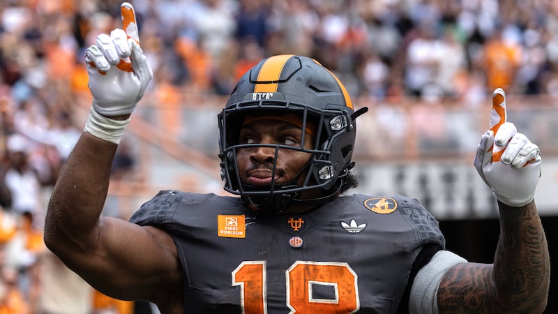 Tennessee running back DeSean Bishop reacts after scoring a touchdown during the second half...