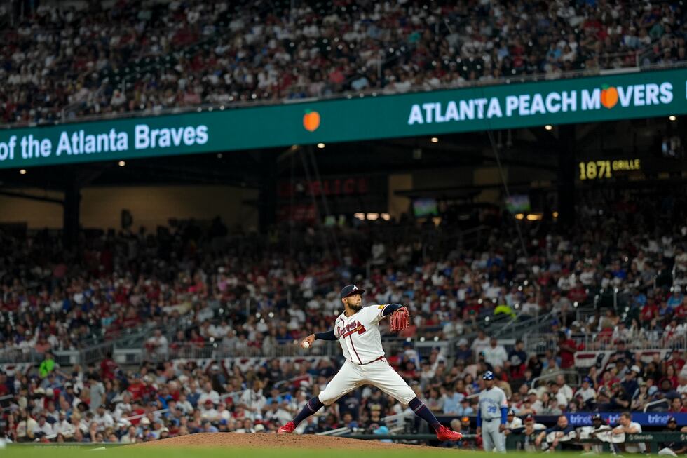 Atlanta Braves pitcher Robert Suarez (75) works in the eighth inning of an opening-day...