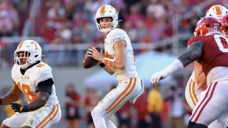 FAYETTEVILLE, AR - October 10, 2026 - Quarterback George MacIntyre #12 of the Tennessee...