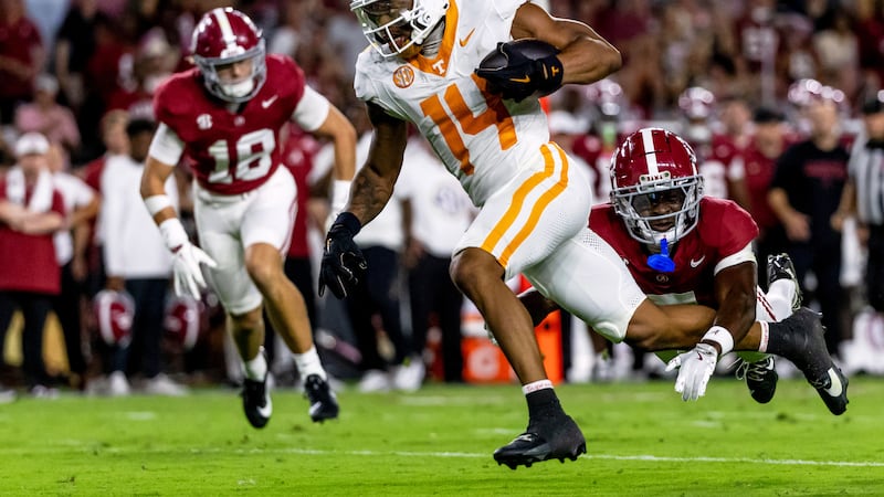 Tennessee wide receiver Braylon Staley (14) gets yards after a catch with Alabama defensive...