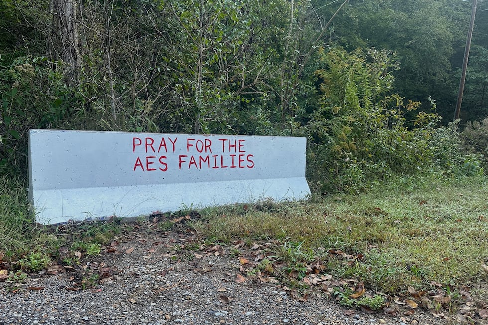 A sign is displayed near the site of an explosion at a explosives manufacturing plant about 60...