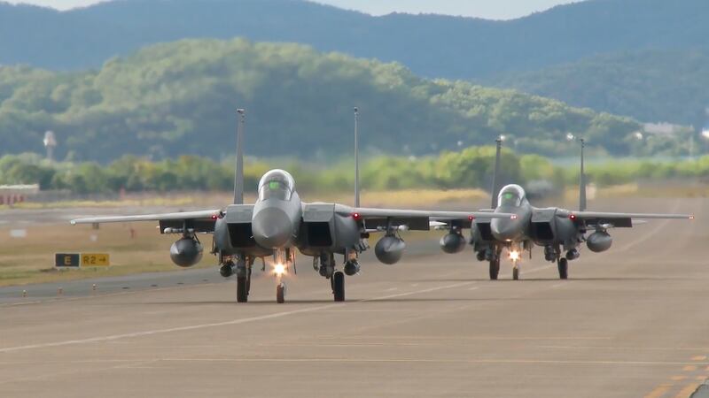 FILE - In this image taken from video, South Korean Air Force's F15K fighter jets prepare to...
