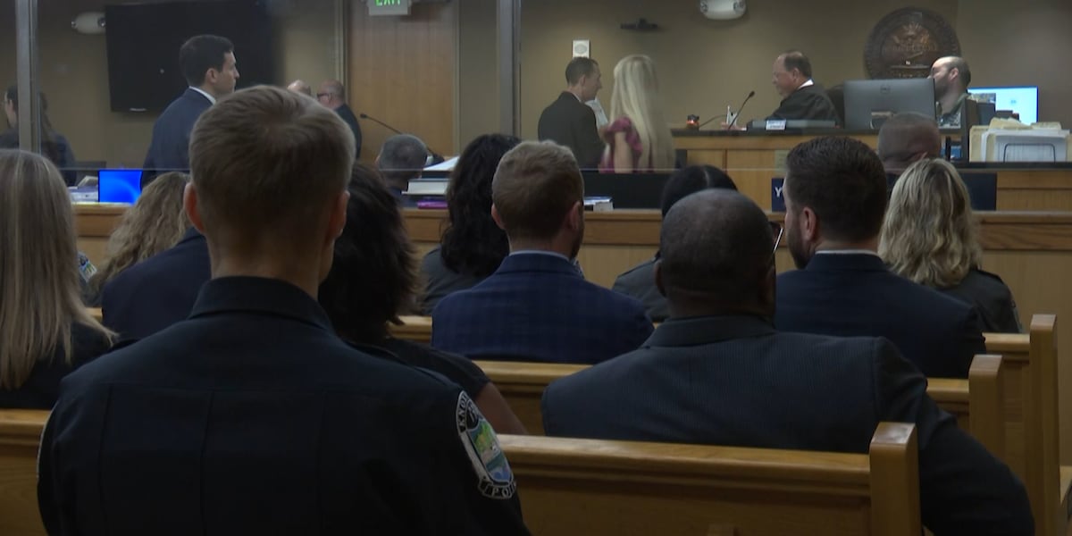 Officers pack courtroom for suspect's first appearance after shooting of KPD crime scene technician