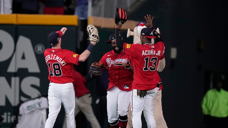 Atlanta Braves outfielders Mike Yastrzemski (18), Michael Harris II (23) and Ronald Acuña Jr....
