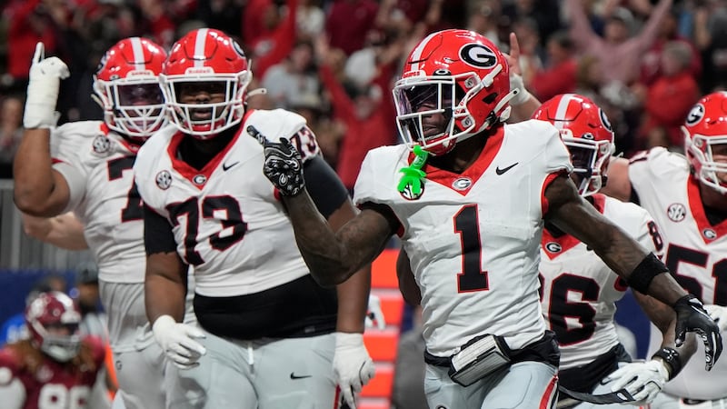 Georgia wide receiver Zachariah Branch (1) celebrates his touchdown against Alabama during the...