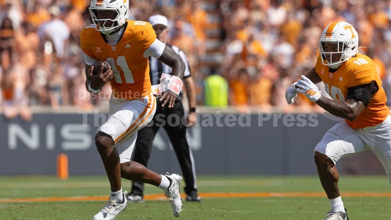 Tennessee quarterback Faizon Brandon (11) runs for yardage during the first half of an NCAA...